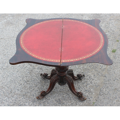 33 - A 19th century rosewood card table with carved base and red gilt tooled leather interior, approx 93c... 