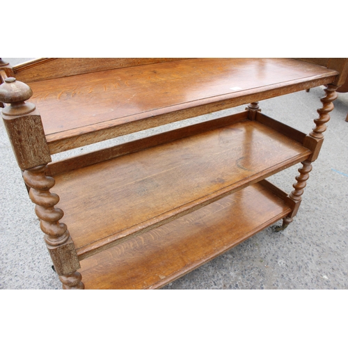 29 - An antique oak 3 tier buffet stand with barleytwist supports, approx 136cm wide x 130cm tall x 51cm ... 