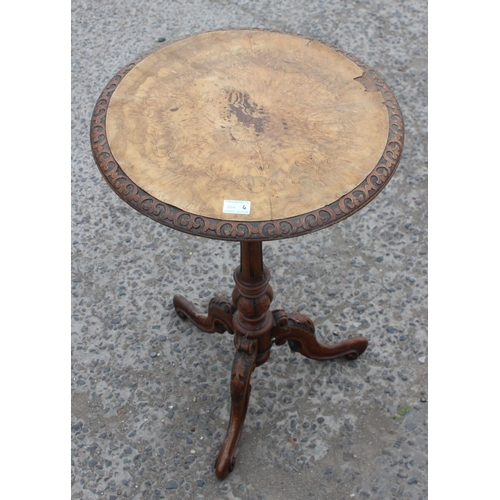 38 - A 19th century walnut wine table with carved base and marquetry inlay, approx 50cm in diameter