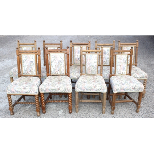 13 - A matched set of 9 Arts & Crafts period oak chairs with later upholstery, the backs matching, some w... 