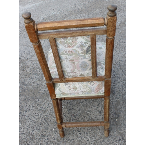 13 - A matched set of 9 Arts & Crafts period oak chairs with later upholstery, the backs matching, some w... 