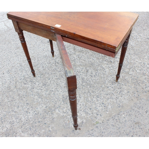 27 - A Victorian mahogany tea table with turned legs, approx 93cm wide x 75cm tall x 93cm deep when open