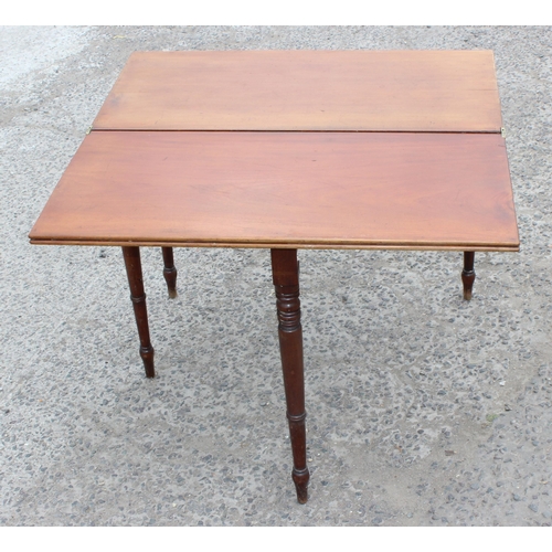 27 - A Victorian mahogany tea table with turned legs, approx 93cm wide x 75cm tall x 93cm deep when open