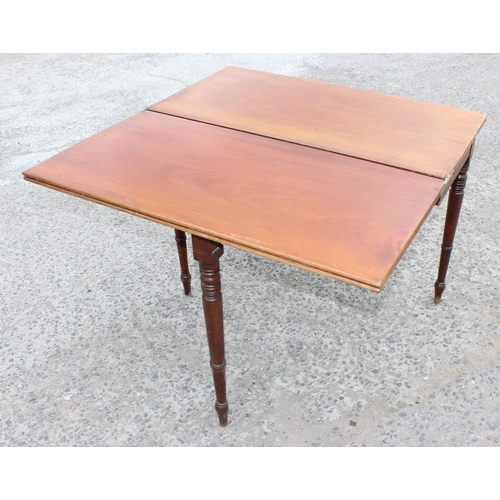 27 - A Victorian mahogany tea table with turned legs, approx 93cm wide x 75cm tall x 93cm deep when open