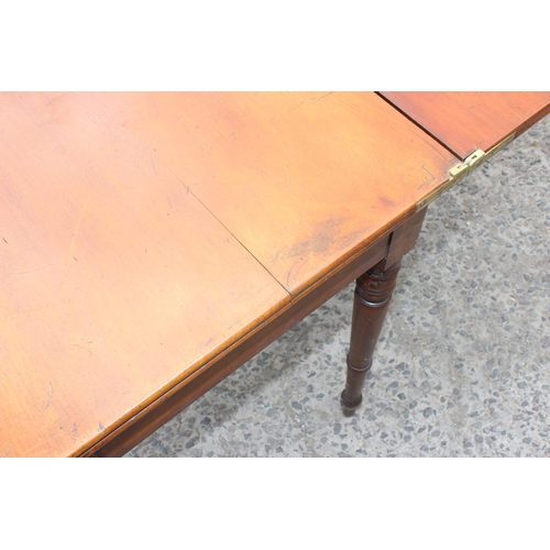 27 - A Victorian mahogany tea table with turned legs, approx 93cm wide x 75cm tall x 93cm deep when open