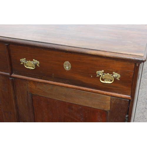 35 - A 19th century mahogany sideboard with 2 drawers over 2 cupboards and brass fittings, approx 126cm w... 