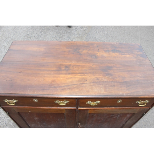 35 - A 19th century mahogany sideboard with 2 drawers over 2 cupboards and brass fittings, approx 126cm w... 