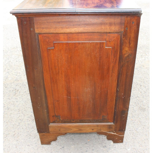 35 - A 19th century mahogany sideboard with 2 drawers over 2 cupboards and brass fittings, approx 126cm w... 