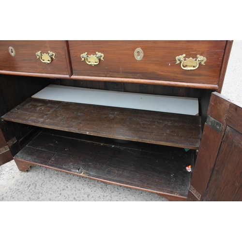 35 - A 19th century mahogany sideboard with 2 drawers over 2 cupboards and brass fittings, approx 126cm w... 