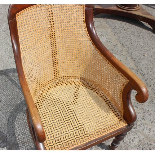 36 - A Regency or William IV period mahogany framed and Bergere seated library chair