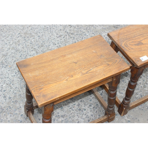 19 - A pair of early 20th century oak coffin stools, approx 46cm wide x 44cm tall x 26cm deep