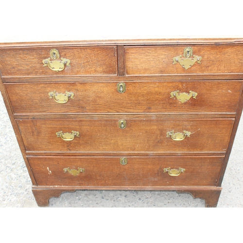 18 - A Georgian 2 over 3 oak chest of drawers with brass handles, approx 96cm wide x 94cm tall x 68cm dee... 