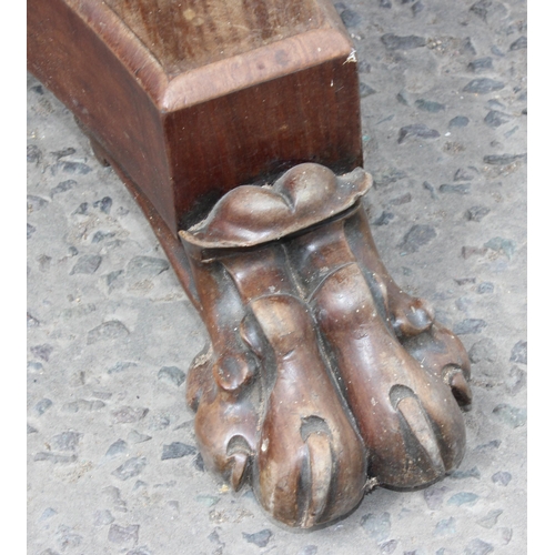 28 - A 19th century mahogany tilt topped breakfast table with impressive carved pedestal base with lion p... 