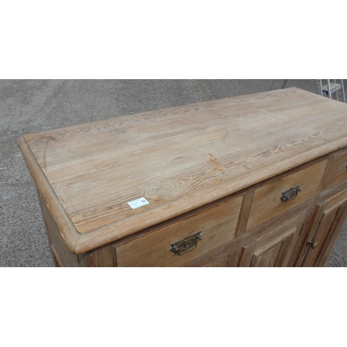 1 - A 19th century pitch pine sideboard with 3 drawers over 3 cupboards, approx 137cm wide x 92cm tall x... 