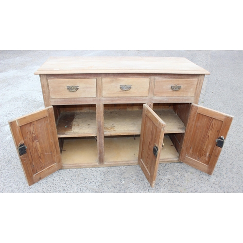 1 - A 19th century pitch pine sideboard with 3 drawers over 3 cupboards, approx 137cm wide x 92cm tall x... 