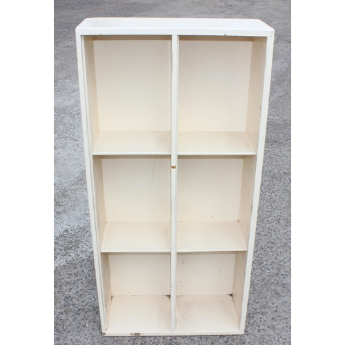 12 - A vintage painted wooden 6 compartment shelf unit, believed to be pine but with very thick paintwork... 