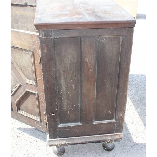 14 - An 18th century 2 door oak cupboard standing on ball feet, approx 130cm wide x 102cm tall x 55cm dee... 