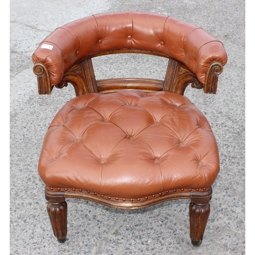 11 - An antique brown leather and oak library or desk chair with Chesterfield studded upholstery, likely ... 