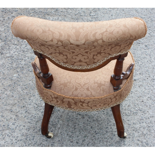 10 - A Victorian round seated bedroom chair with caramel coloured upholstery