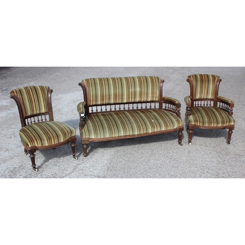 6 - An Edwardian 3 piece salon suite with striped green upholstery, with brass and ceramic castors