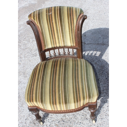 6 - An Edwardian 3 piece salon suite with striped green upholstery, with brass and ceramic castors