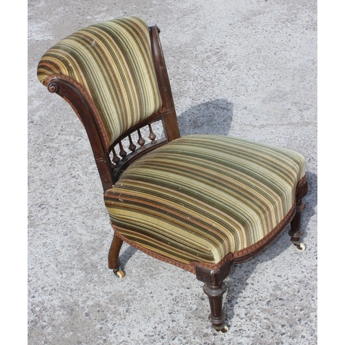 6 - An Edwardian 3 piece salon suite with striped green upholstery, with brass and ceramic castors