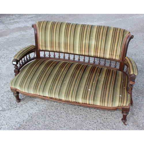 6 - An Edwardian 3 piece salon suite with striped green upholstery, with brass and ceramic castors