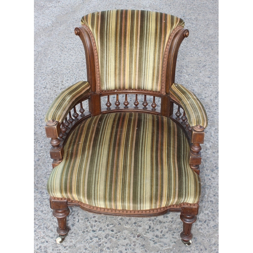 6 - An Edwardian 3 piece salon suite with striped green upholstery, with brass and ceramic castors