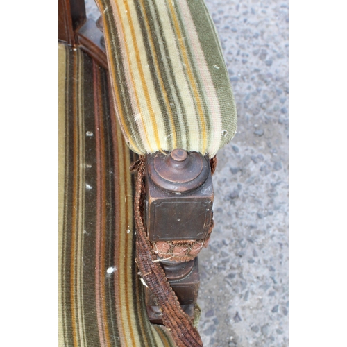 6 - An Edwardian 3 piece salon suite with striped green upholstery, with brass and ceramic castors