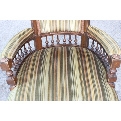 6 - An Edwardian 3 piece salon suite with striped green upholstery, with brass and ceramic castors