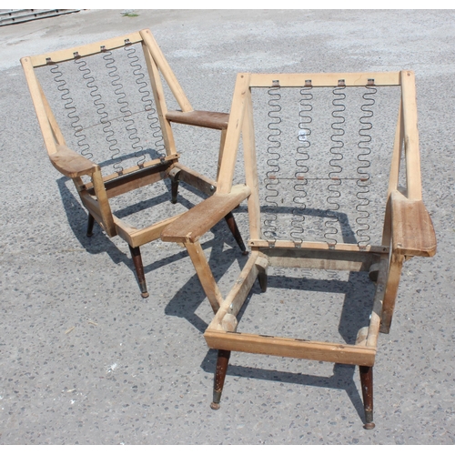 50 - A pair of retro mid-century chair frames, possibly Swedish Lounge Chairs, in the style of Folke Ohls... 