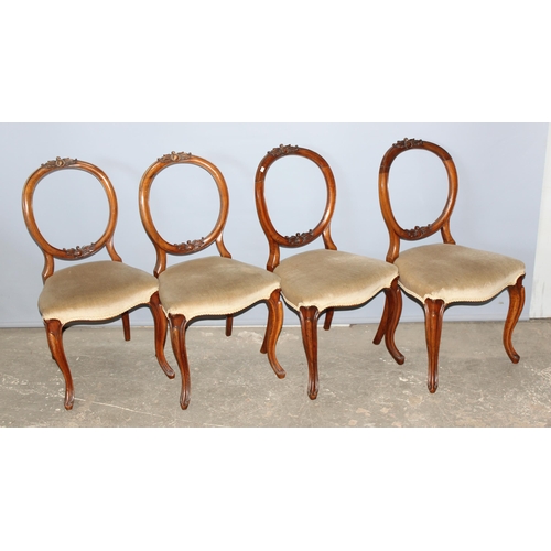 55 - A set of 4 19th century balloon backed chairs with carved details and stuffed seats