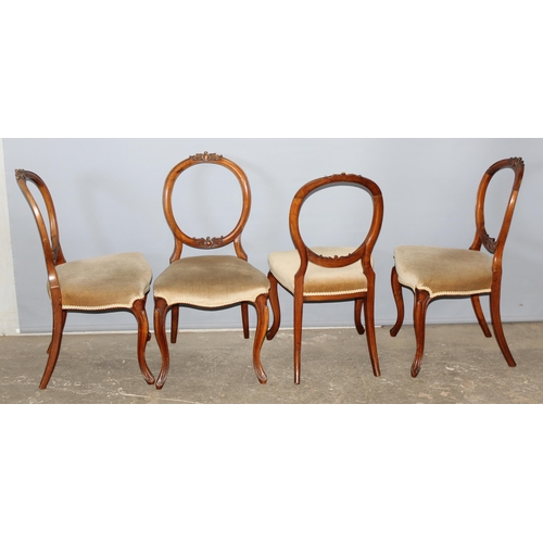 55 - A set of 4 19th century balloon backed chairs with carved details and stuffed seats