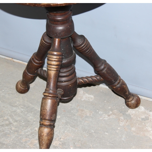 59 - An unusual vintage oak twist topped stool with turned legs, approx 35cm wide x 50cm tall