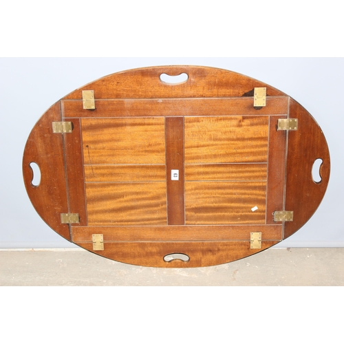 63 - An antique folding mahogany butler's tray with brass hinges, approx 108cm wide x 76cm deep