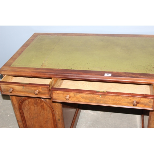 64 - A Victorian mahogany pedestal desk with 3 drawers over 2 cupboards, one cupboard containing a bank o... 