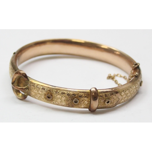 1101 - 9ct gold cuff bangle formed as an engraved belt, marked rubbed but XRF confirmed to be 9ct gold, app... 