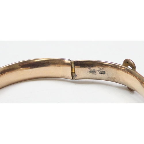 1101 - 9ct gold cuff bangle formed as an engraved belt, marked rubbed but XRF confirmed to be 9ct gold, app... 