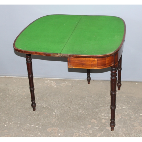 128 - Victorian mahogany demi-lune folding card table with green baize