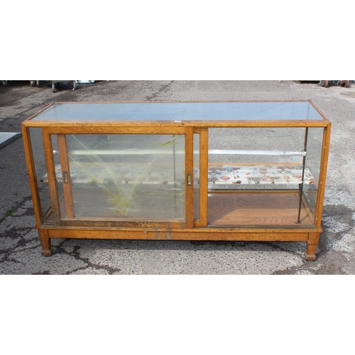 154 - Large antique wooden & glazed shop display unit with interior shelf and sliding doors, approx 179cm ... 