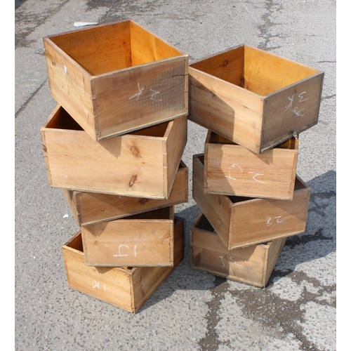 156 - 9 antique stained pine shop counter drawers with cup handles