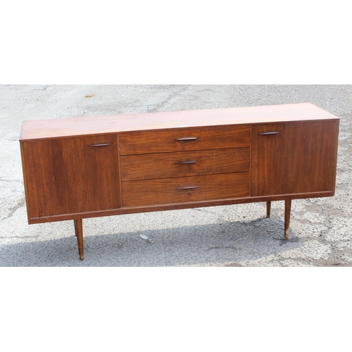 161 - Retro teak sideboard with slightly curved frontage, 2 cupboards and 3 central drawers, possibly Aust... 