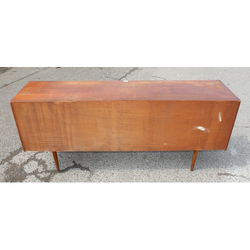 161 - Retro teak sideboard with slightly curved frontage, 2 cupboards and 3 central drawers, possibly Aust... 