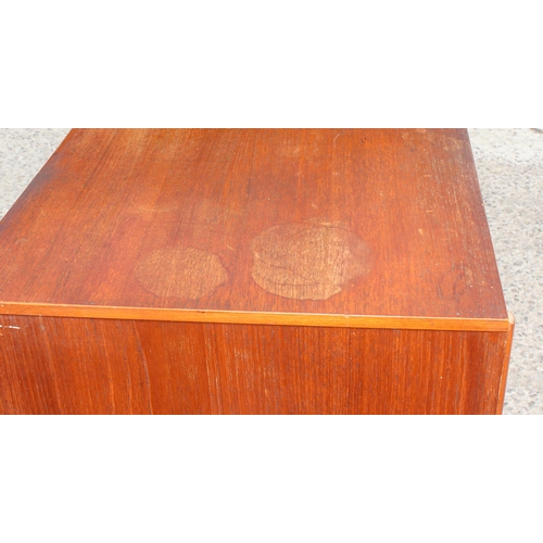 161 - Retro teak sideboard with slightly curved frontage, 2 cupboards and 3 central drawers, possibly Aust... 