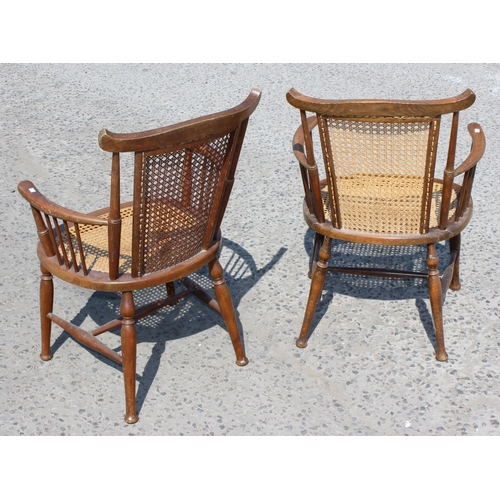 101 - A pair of early 20th century bergere seated armchairs