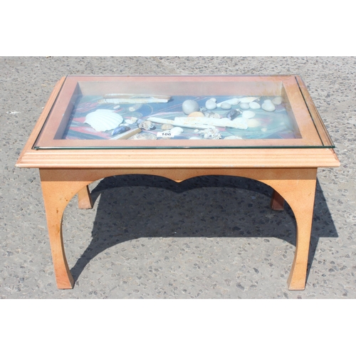 106 - David Moren Brown, local cabinet maker, a light painted and glass topped bijouterie table containing... 