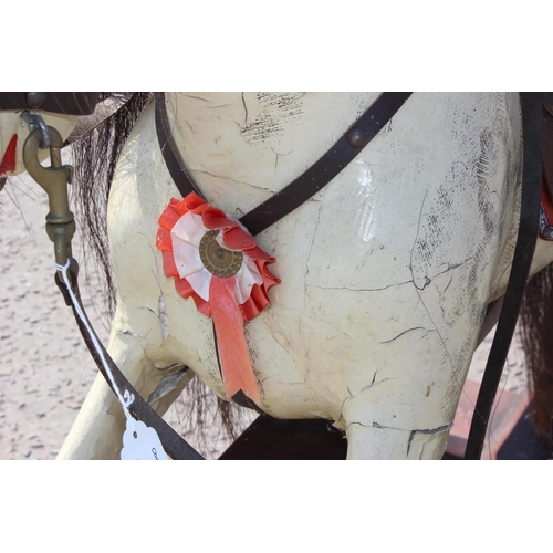 110 - A vintage painted carved wooden rocking horse on wooden frame, approx 108cm long