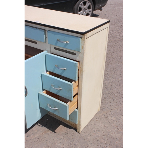 113 - A retro mid-century Formica topped kitchen cabinet in white and light blue with a single cupboard an... 