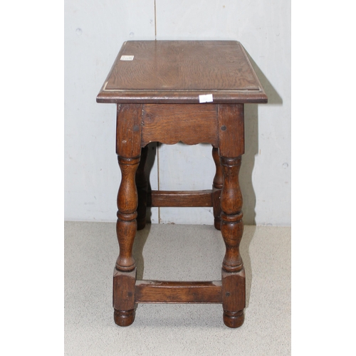 176 - A small vintage oak coffin stool, approx 45xm wide