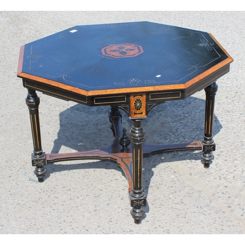 54 - A late Victorian or Edwardian ebonised and amboyna octagonal library or centre table with inlay, app... 